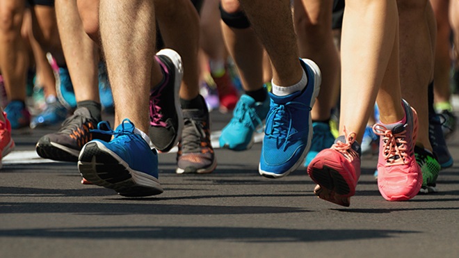 close-up on the shoe of people running